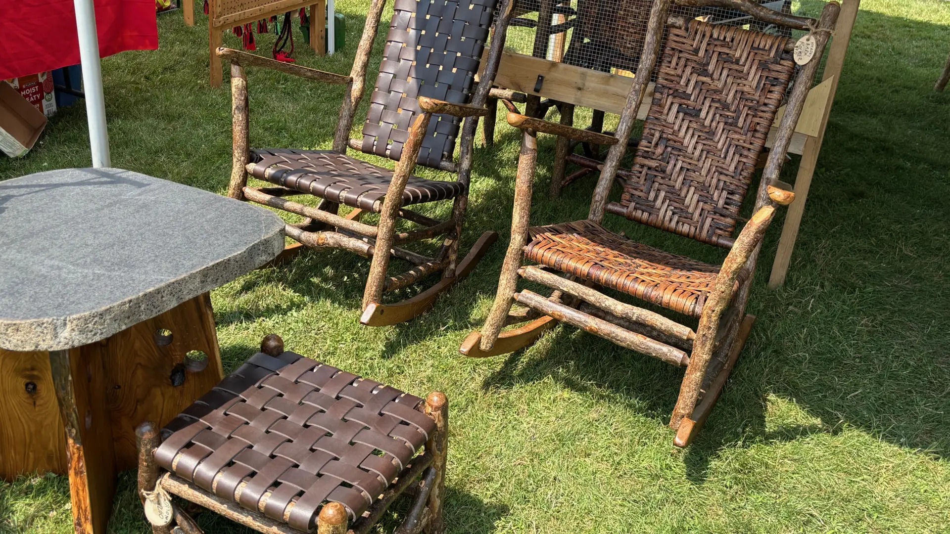Rocking chairs made with rustic frames and woven bark seats and backs.