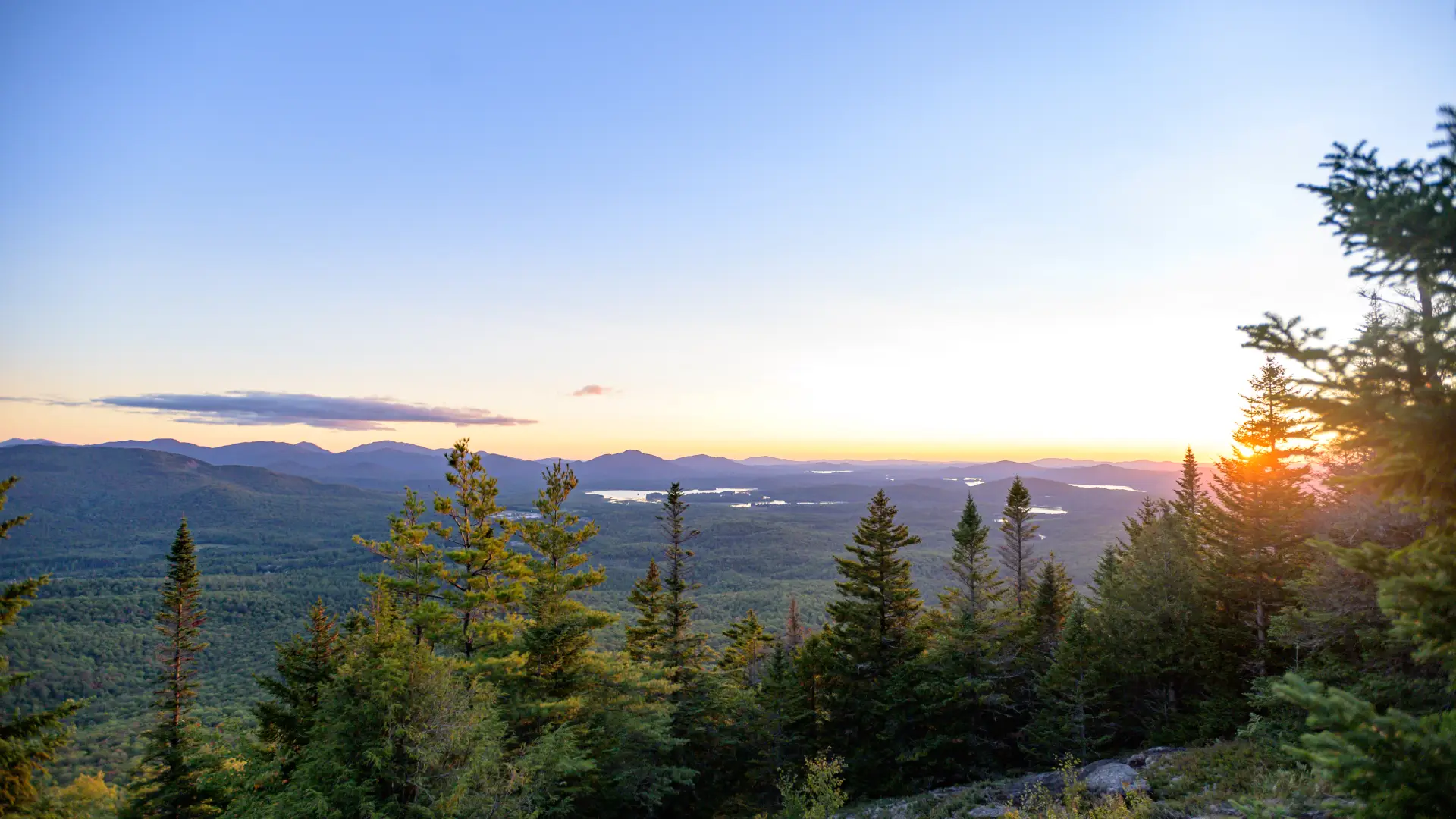 Sunset on a partially-treed mountain