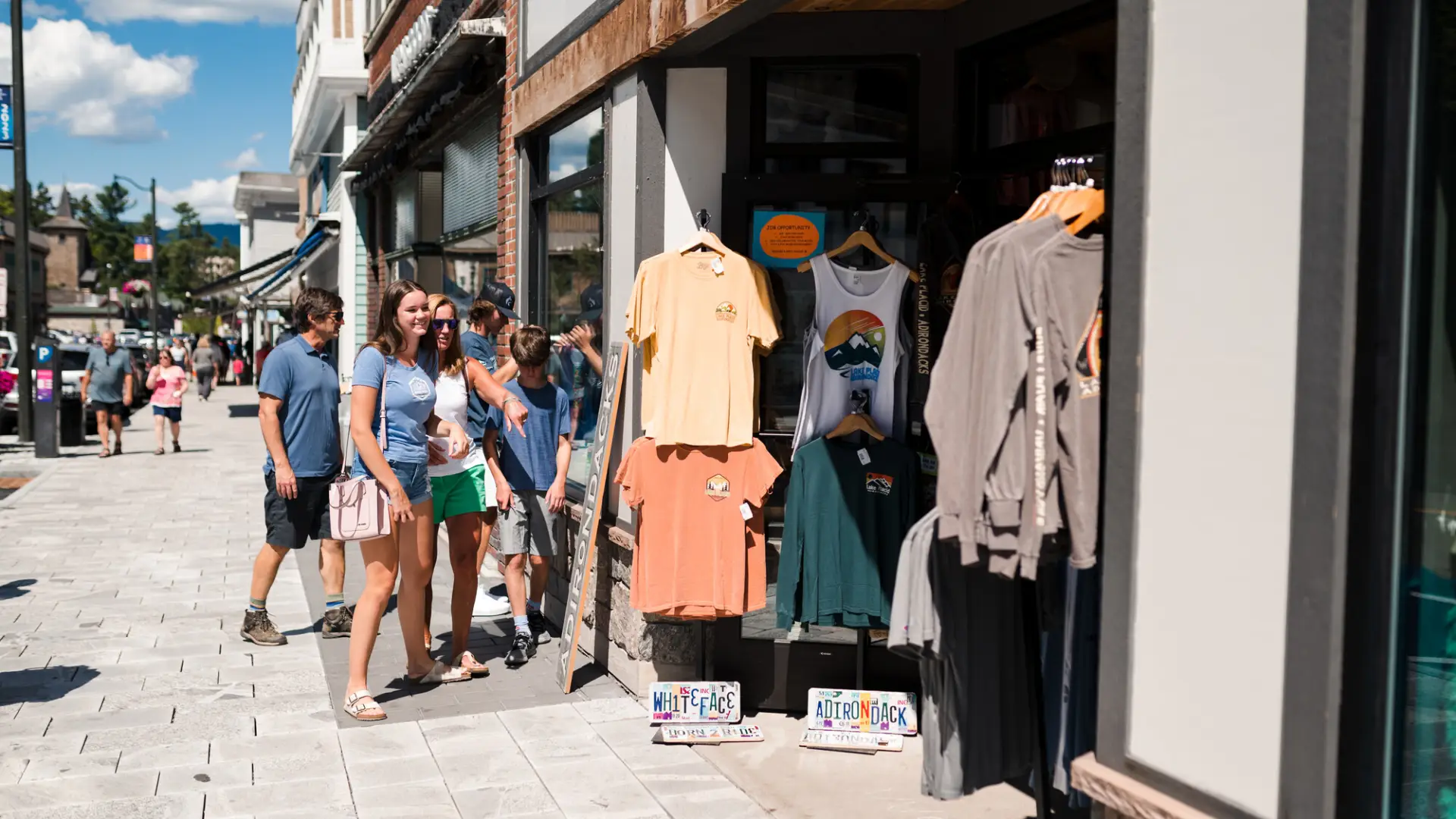A family explores the shops on Lake Placid's Main Street.