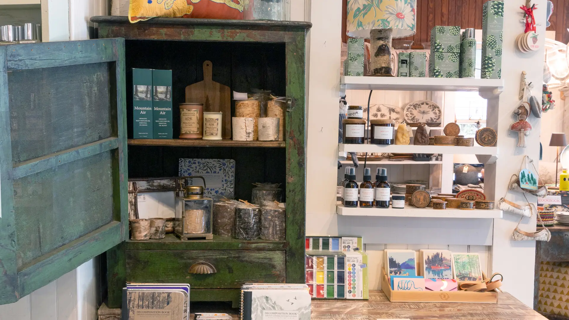 Greeting cards, notebooks, candles and room sprays on display by the counter