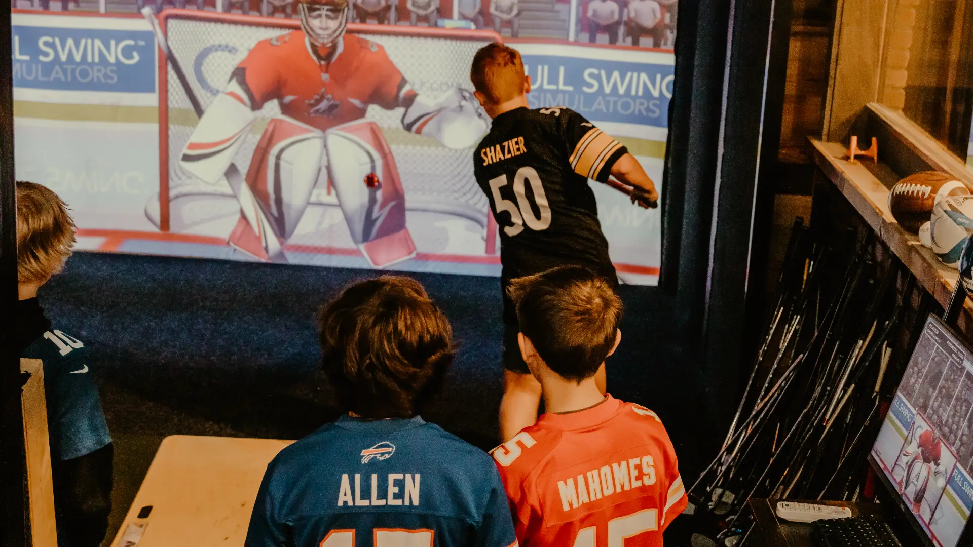 kids play simulator hockey.  Photo Credit to A. Kelly.