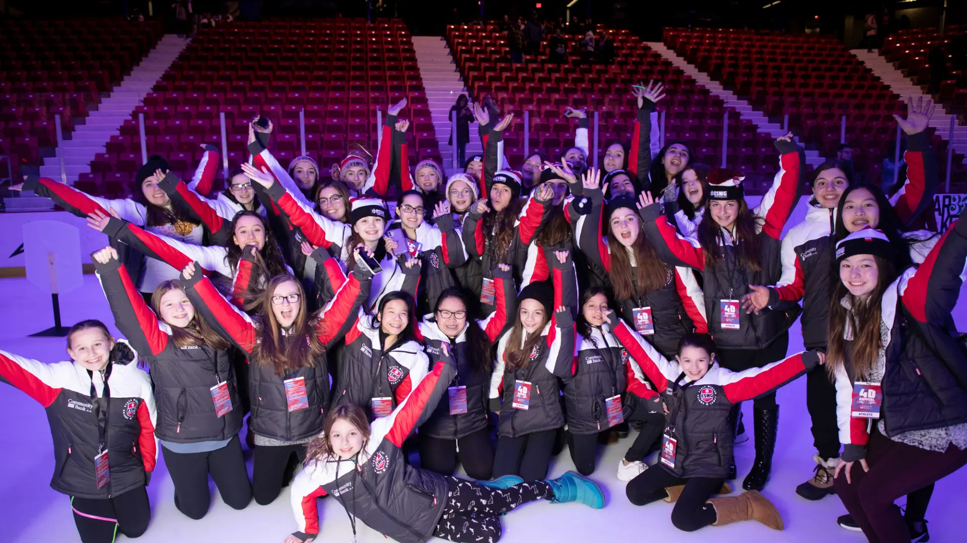 A group of athletes posing for a picture at the opening ceremony.
