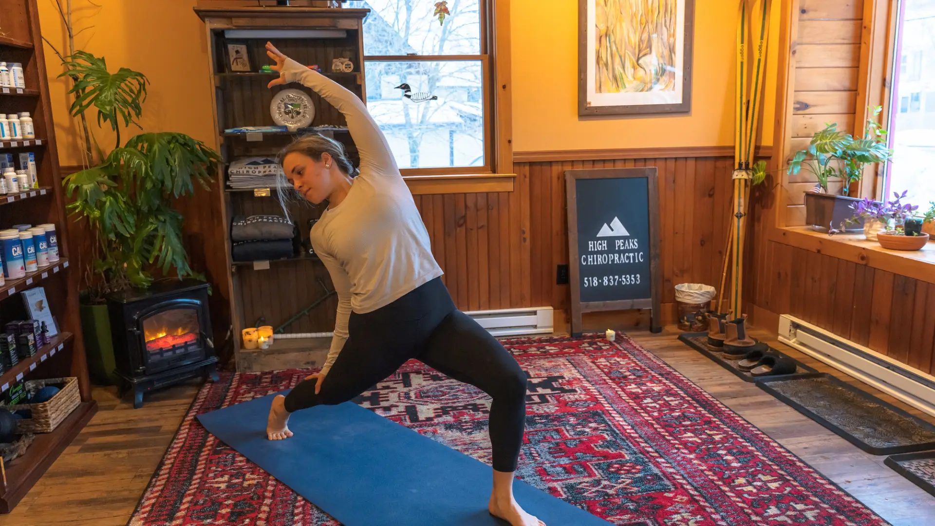 A woman does a yoga pose