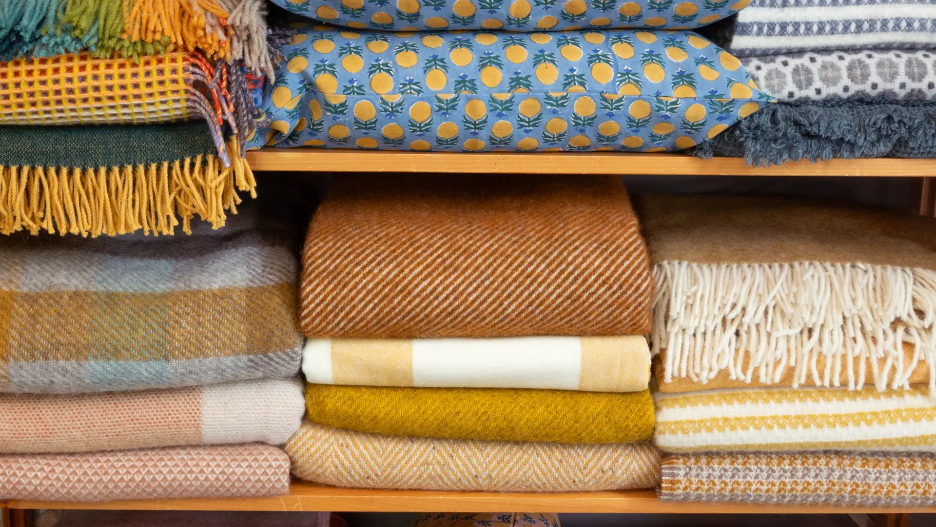 Pillows and wool blankets from floor to ceiling