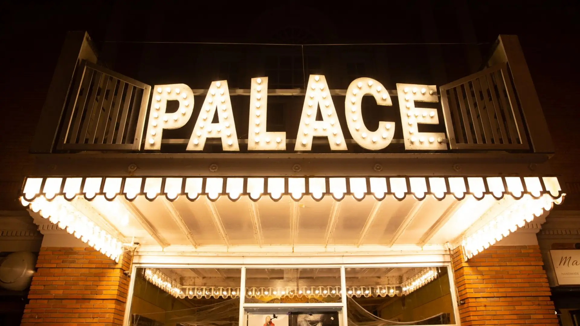 Nighttime view of the entrance of Palace Theater, Lake Placid's movie theater