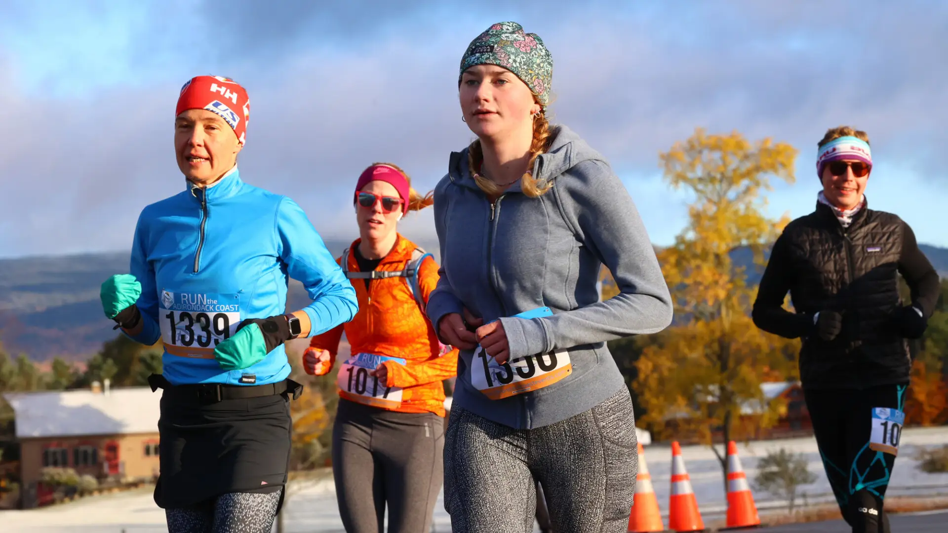 Four runners wearing warm clothes