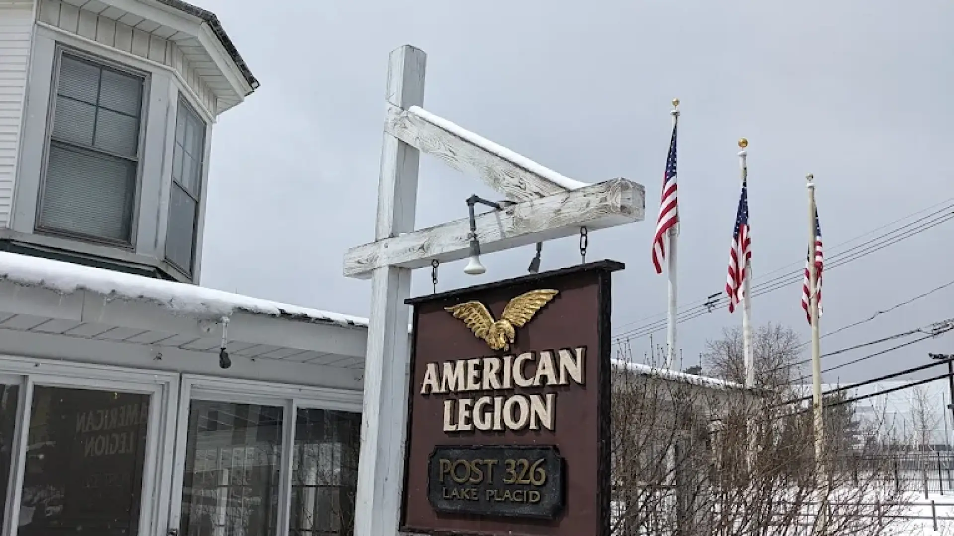 A photo of the exterior of the American Legion Post 326 sign blanketed in snow.