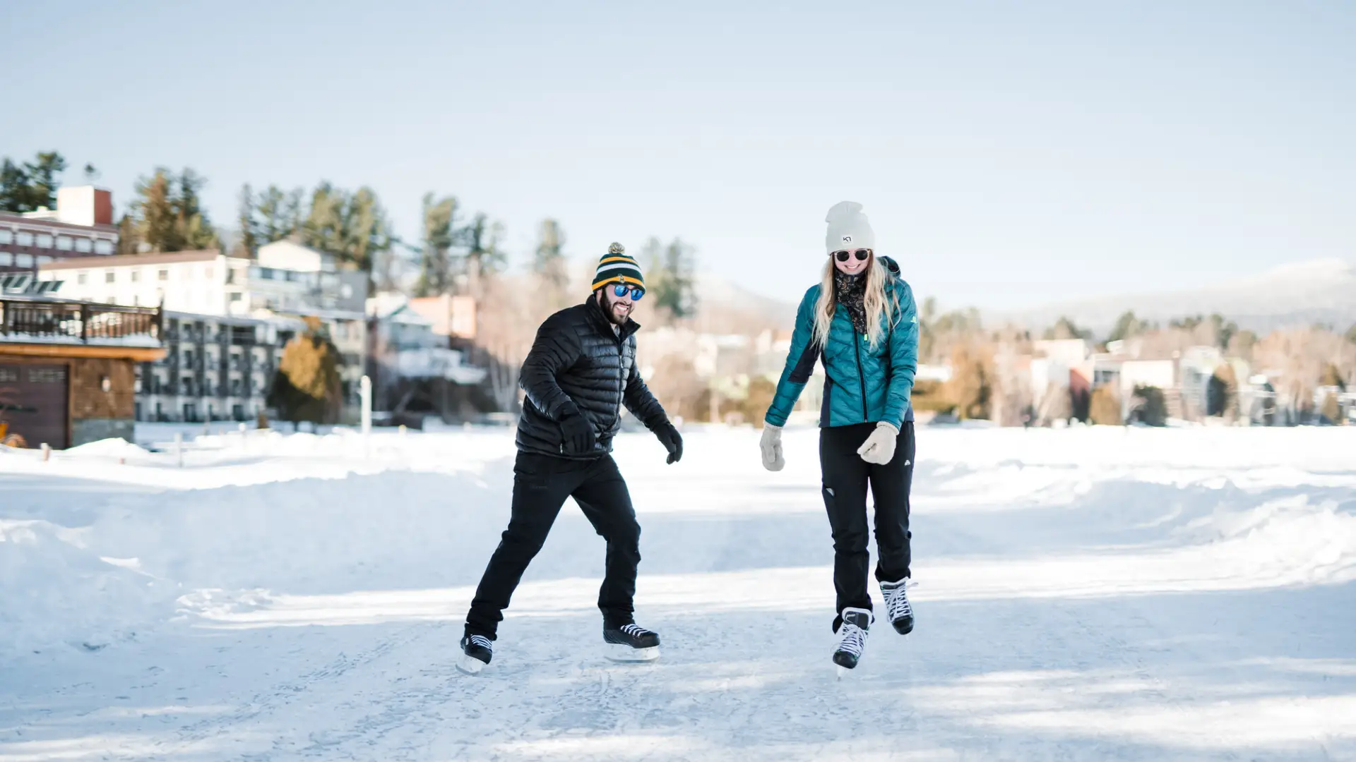 A couple ice skating in Lake Placid.