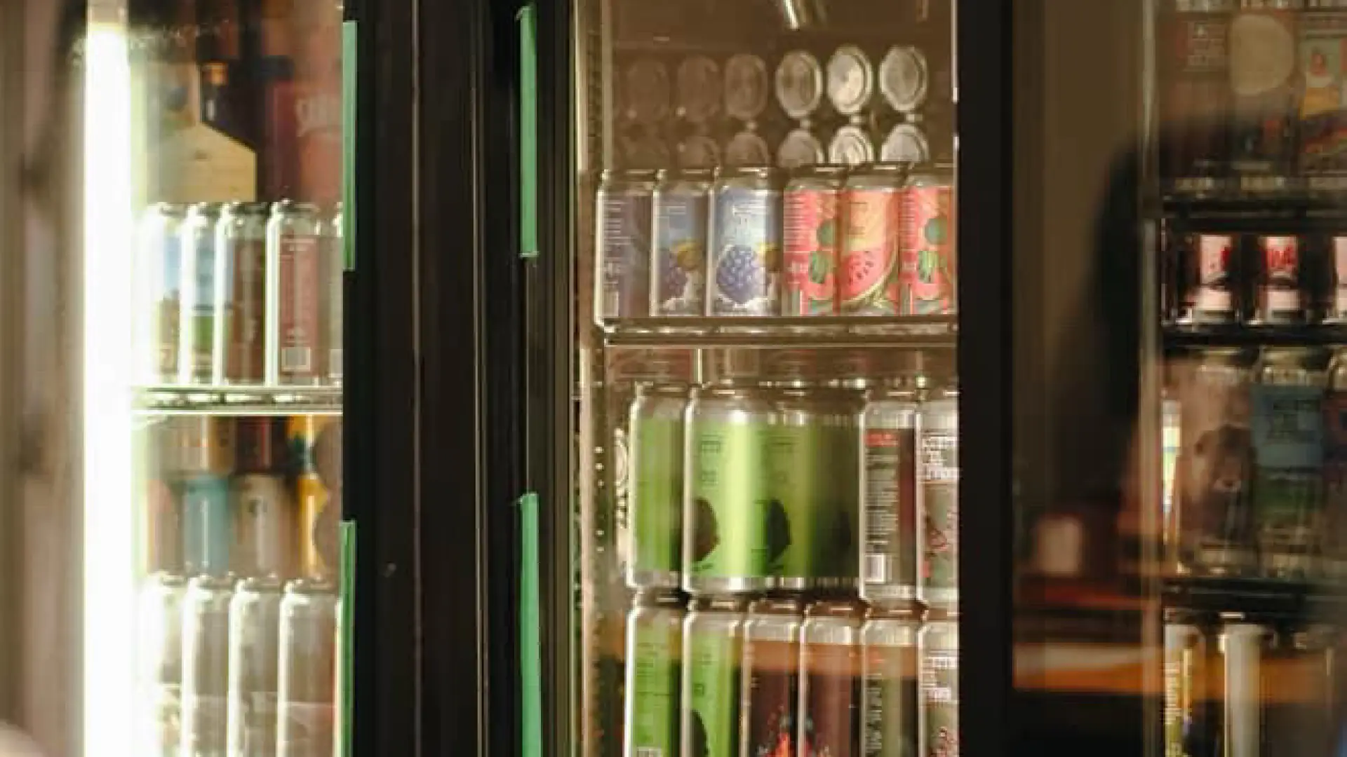 Two fully stocked coolers full of beer