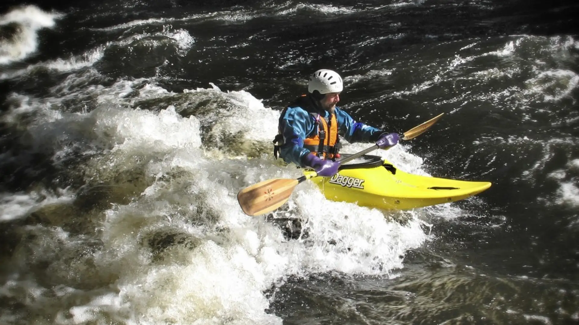 A whitewater kayaker negotiating rapids