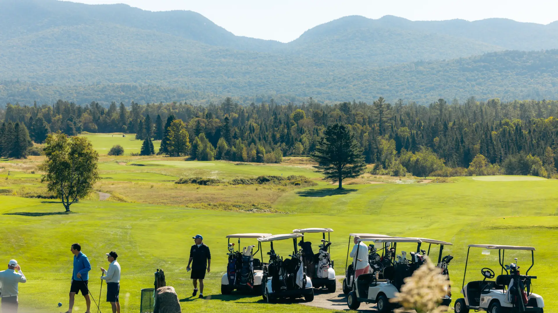 A golf course with mountains in the background.