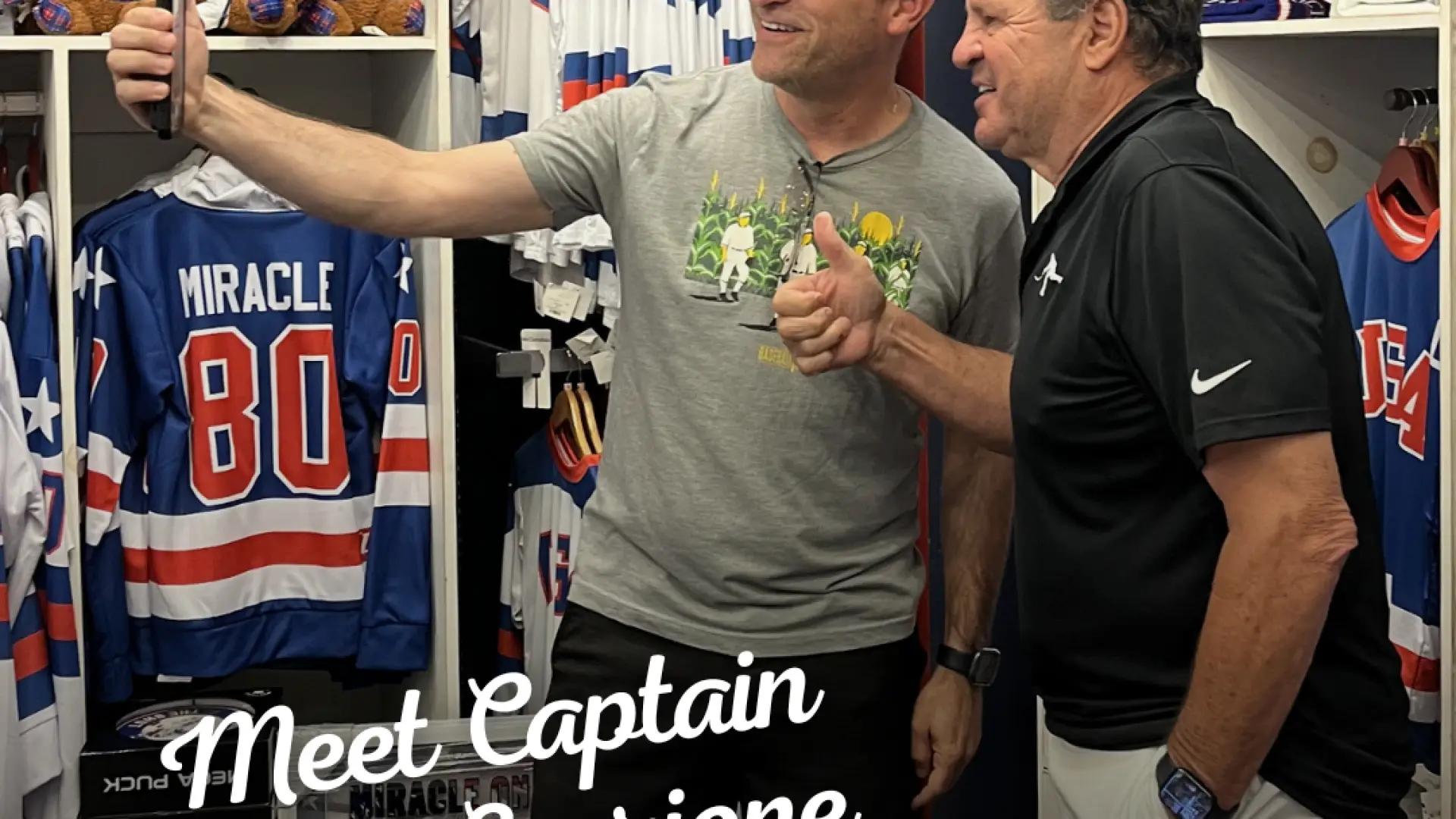 1980 Olympic Gold Medal Men's USA Hockey Team Captain Mike Eruzione poses for selfie in store with fan