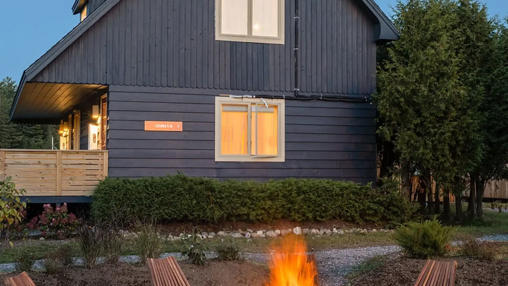A roaring fire in a community fire pit at Eastwind Lake Placid