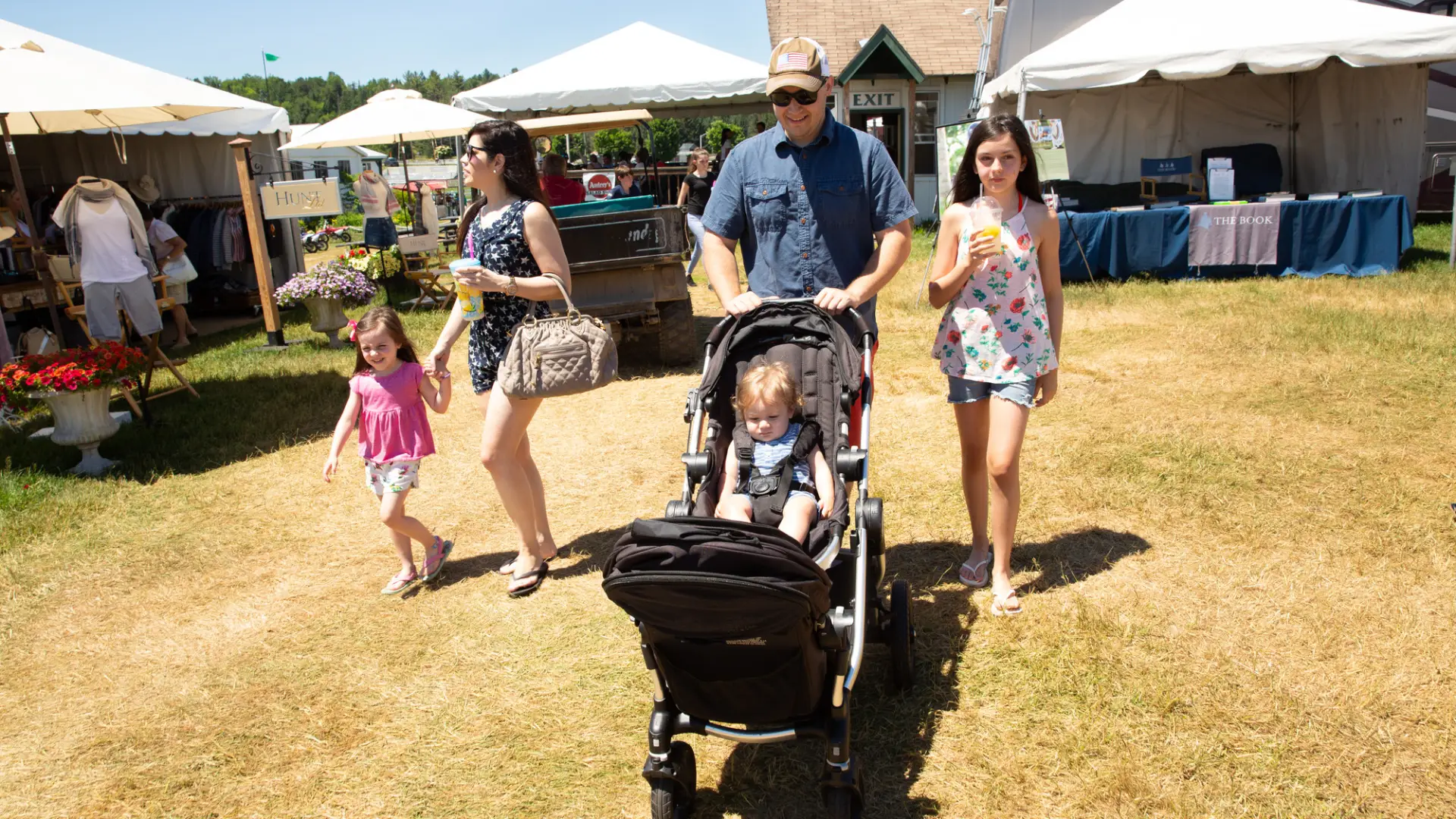 A family strolls together at the Lake Placid Horse Show grounds