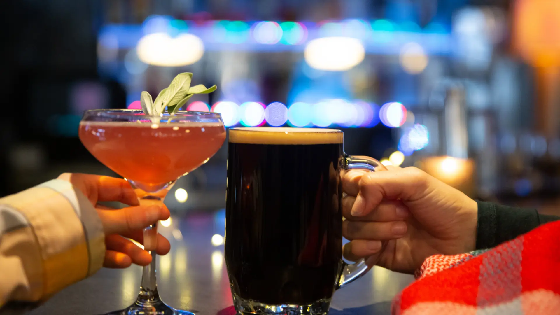 couple cheers with their beverages