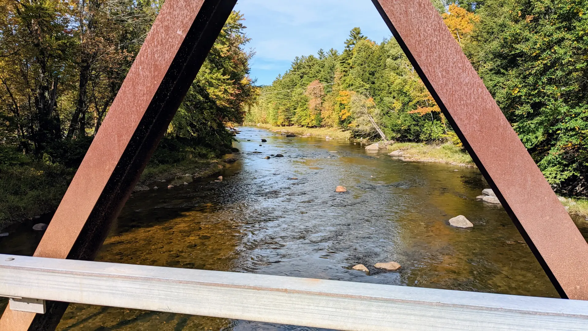The view of a river from a metal bridge