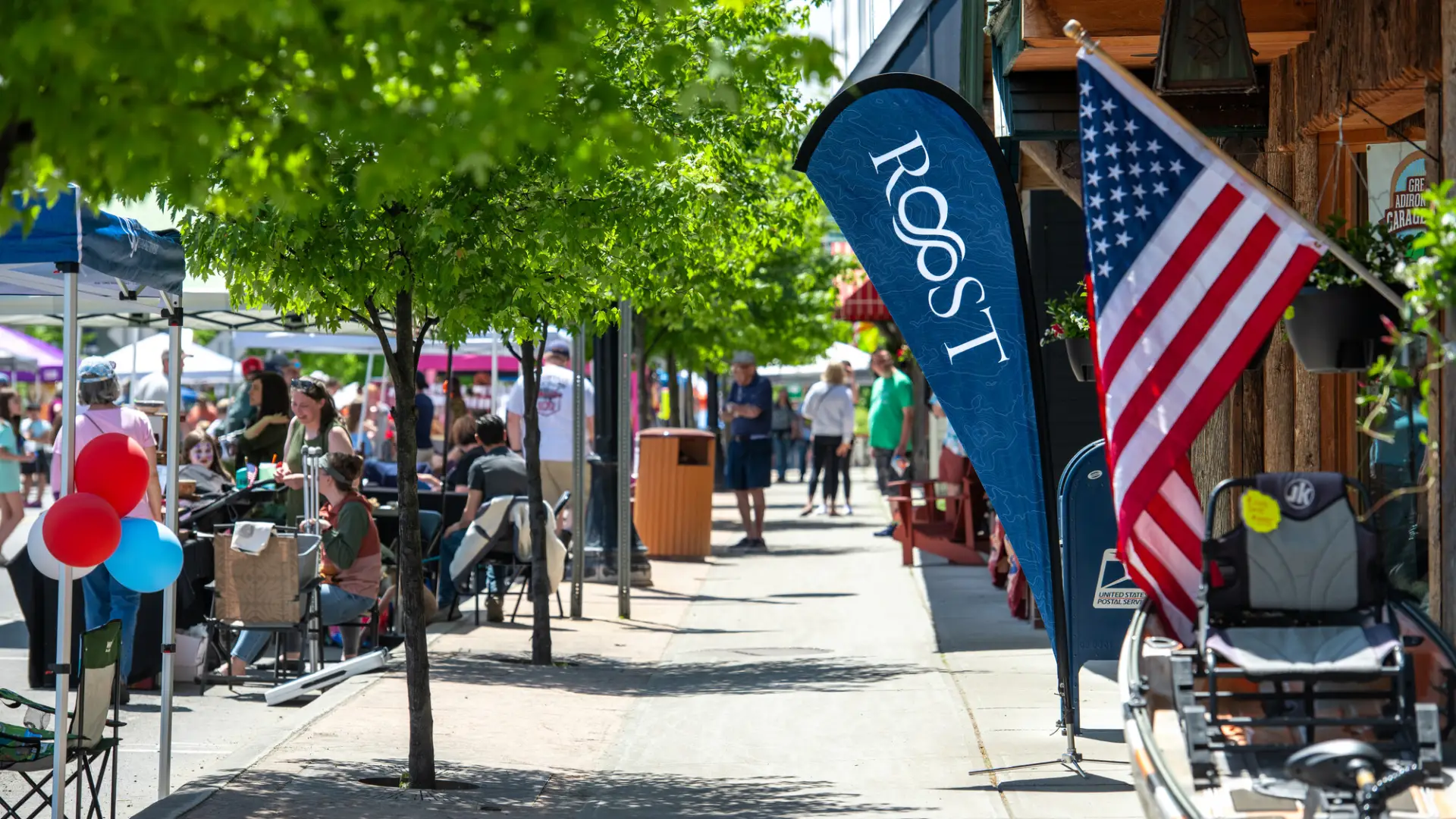 A crowd of people enjoying an event during a sunny day.