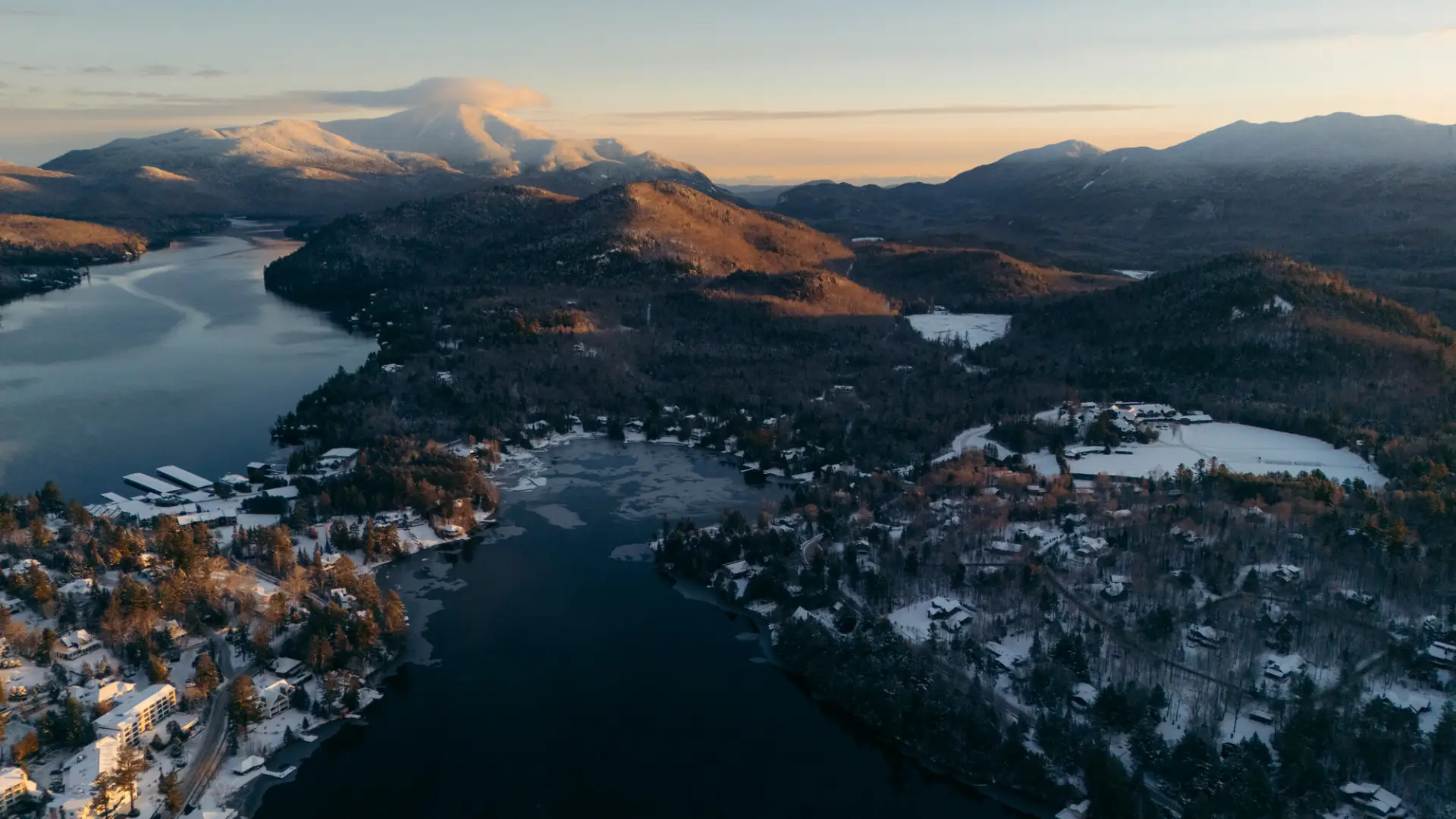 A snowy drone view of Lake Placid.