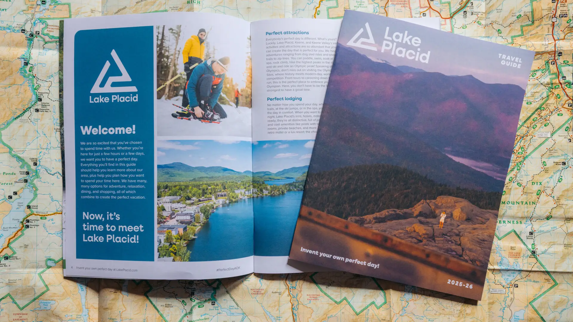 A visitor guide lies open on a map of the Adirondacks.