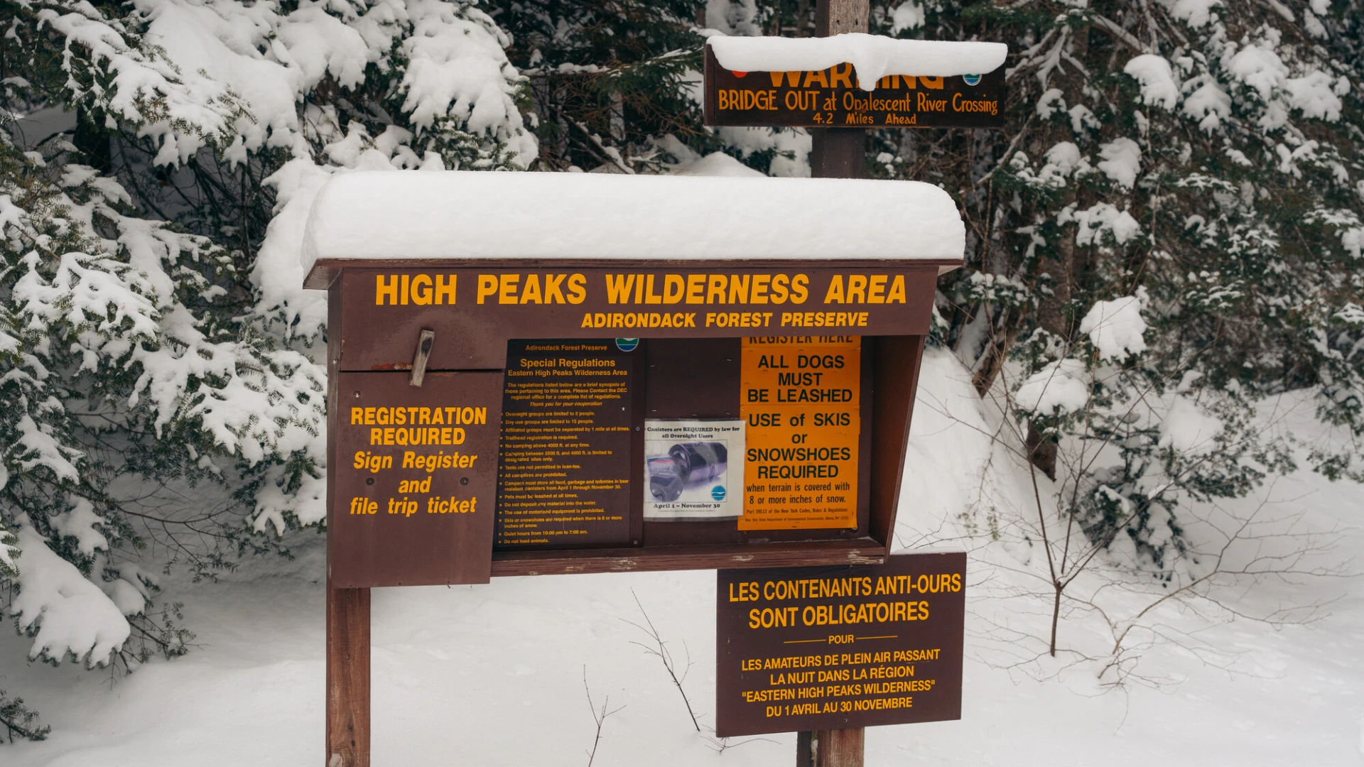 A High Peaks Wilderness trailhead on a snowy trail.
