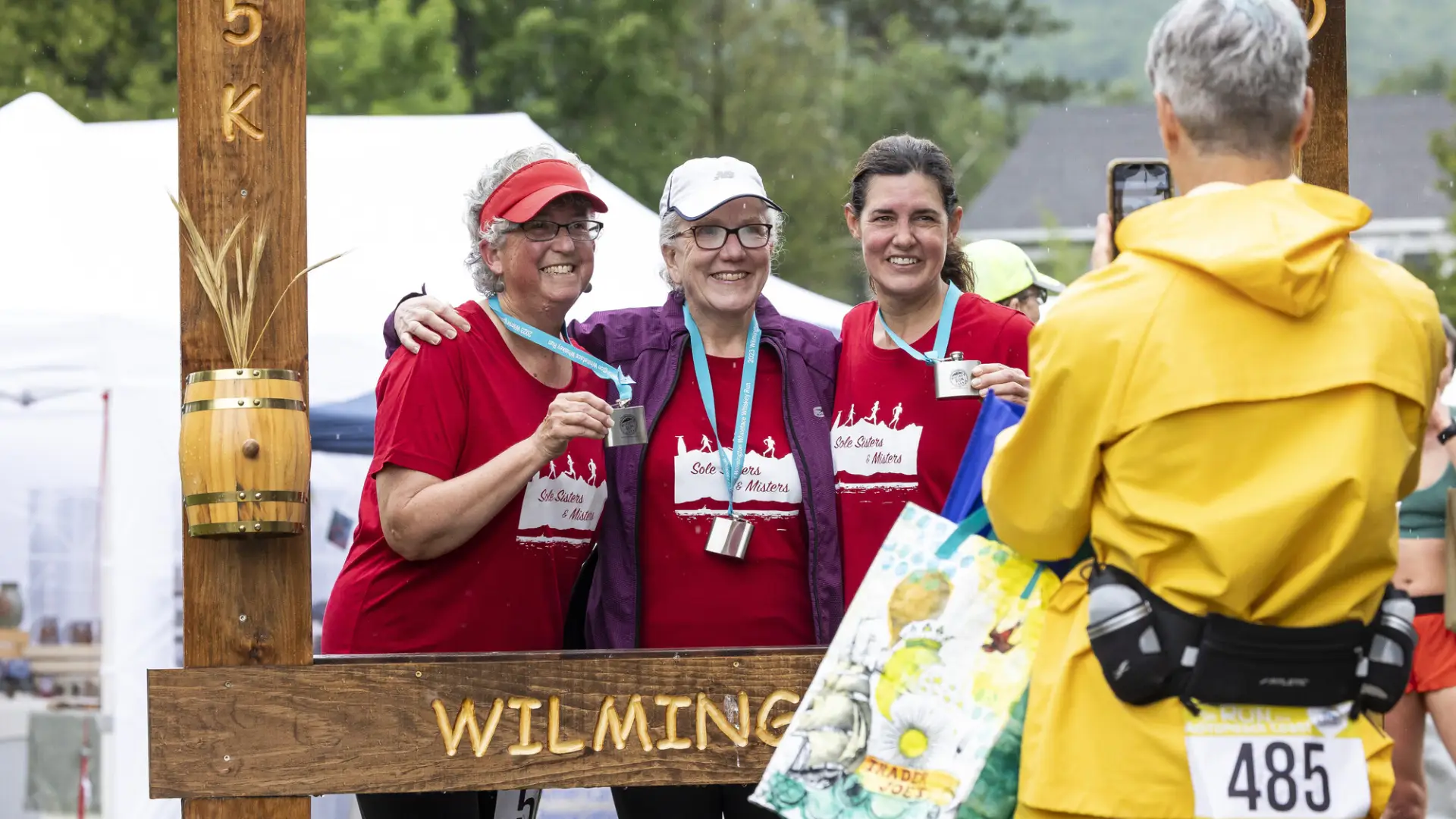 Racers get their photo taken in Whiskey Run photo frame