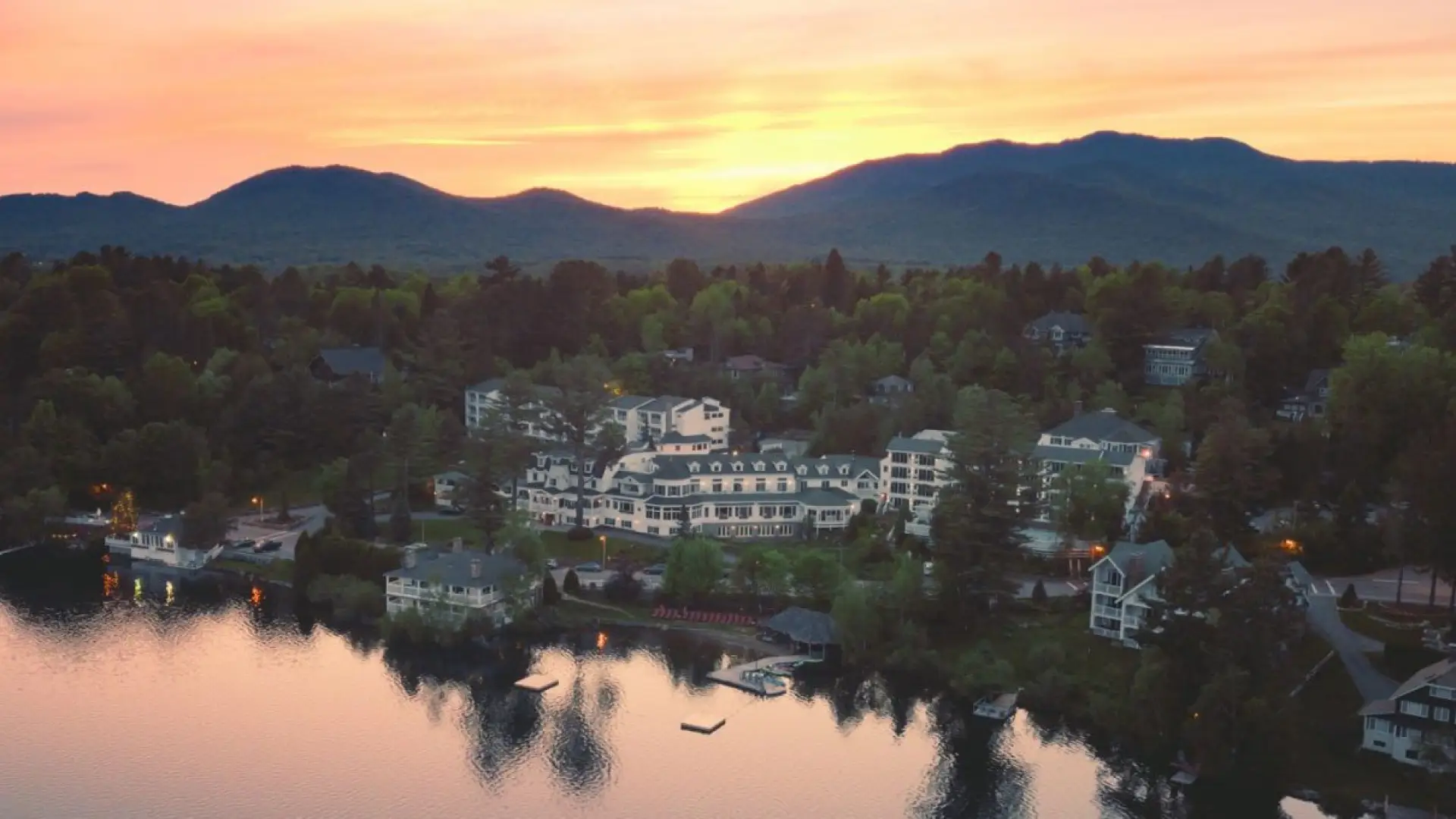 Wide aerial view of the Mirror Lake Inn's numerous buildings overlooking Mirror Lake. Image courtesy Mirror Lake Inn.