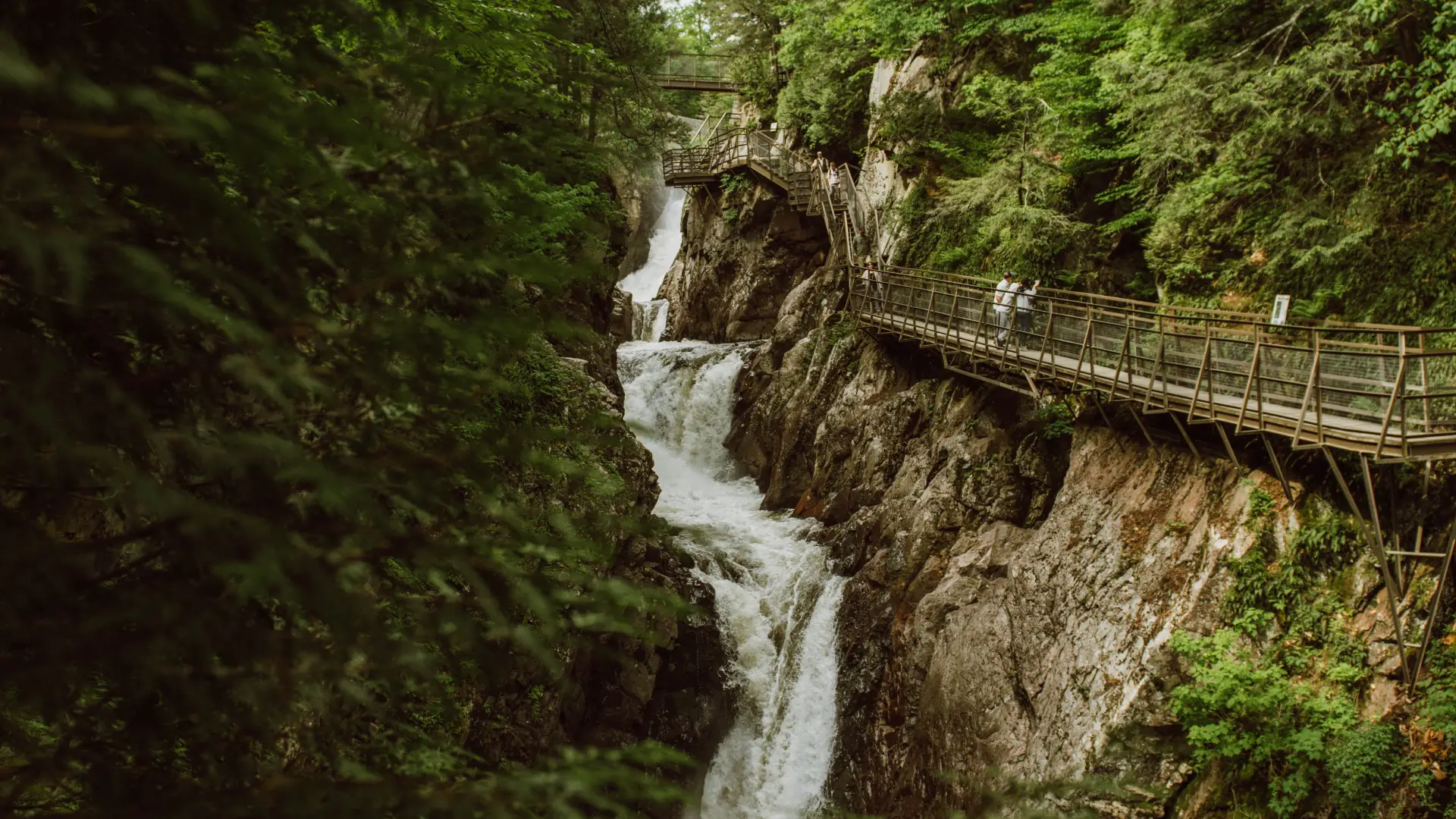 Waterfalls and wooden walkway at High Falls Gorge, one of the top Lake Placid NY summer attractions