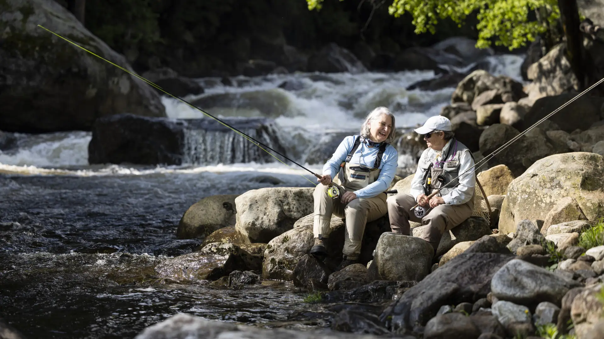 two women fly fishing in the ausable river
