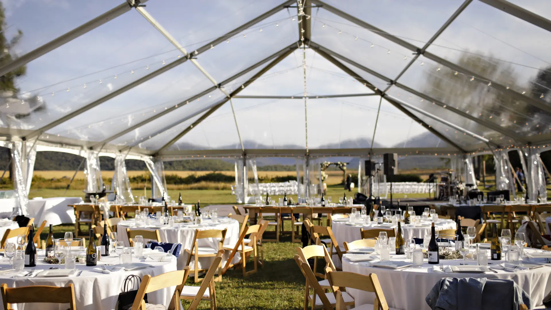 A clear tent allows the surrounding to be the decor