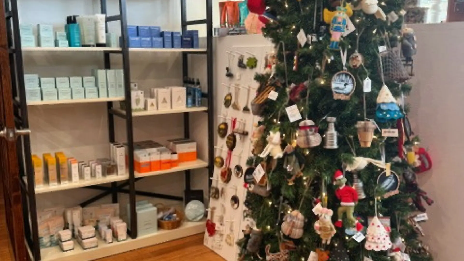 Ornaments and products displayed on a faux tree and tall shelf at The Peaks Boutique at The Mirror Lake Inn.