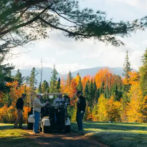 Older guys golfing during fall in Lake Placid