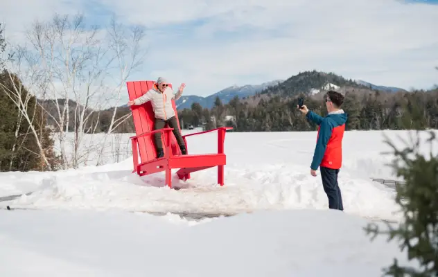 A person posing for a photo on Lake Placid's Main Street.