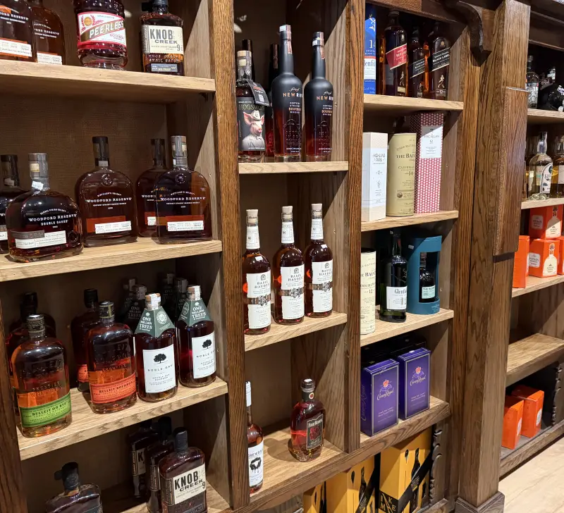 Wooden shelves full of wine and spirits