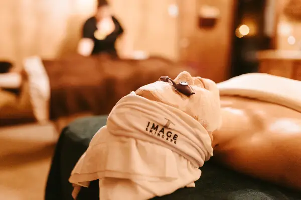 A woman receiving a facial in a Lake Placid spa.