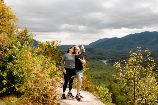 Two people on a semi-rocky summit