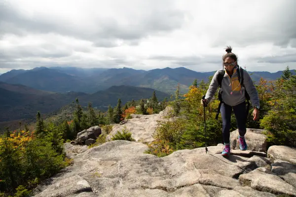 A hiker making her way up Hurricane Mountain's rocky ridge.