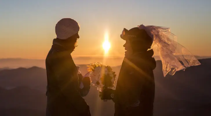 Two women in ski gear get married.