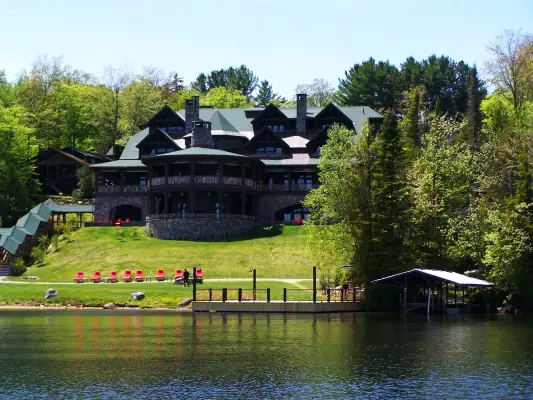 A lodge on a lakeside. 