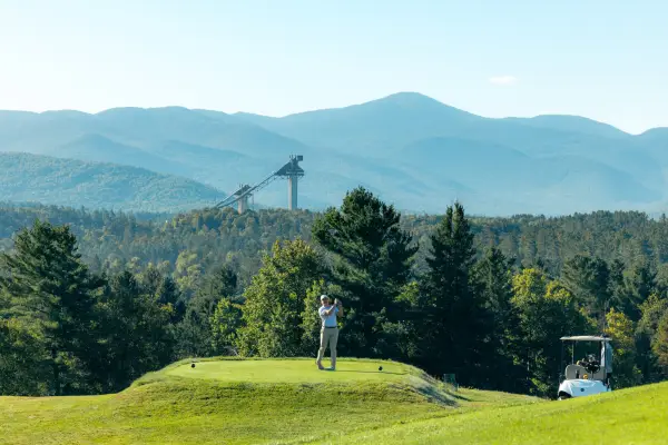 A golferr on the greens in Lake Placid