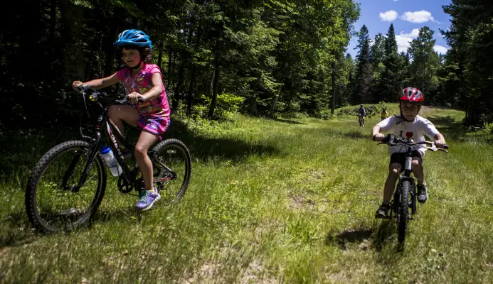 Young kids mountain biking