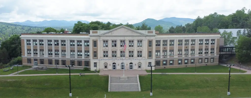 A school on a lawn. 