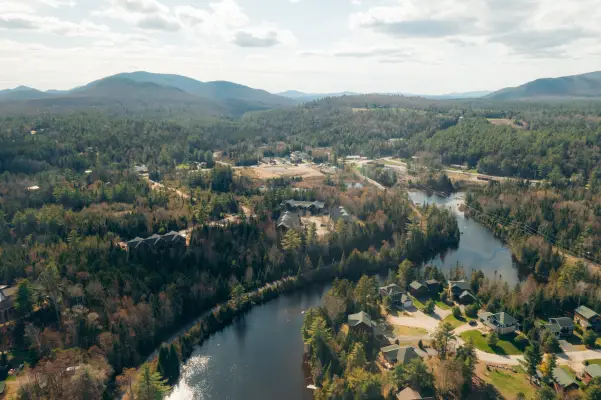 A river in spring surrounded by vacation homes. 