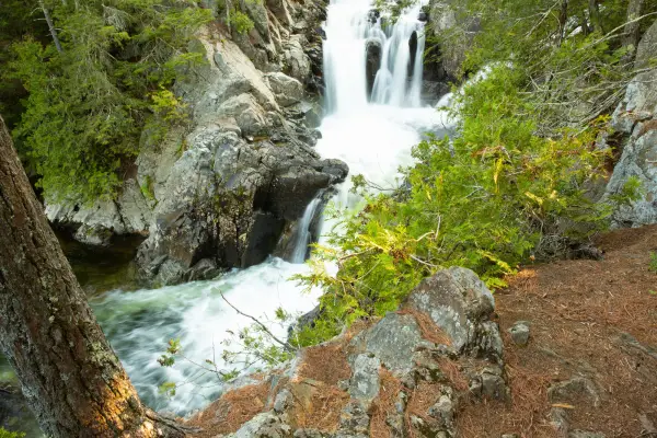 A large waterfall creating two pools in two tiers