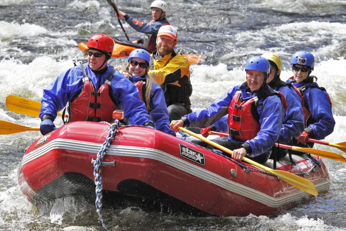 Whitewater rafters in a boat