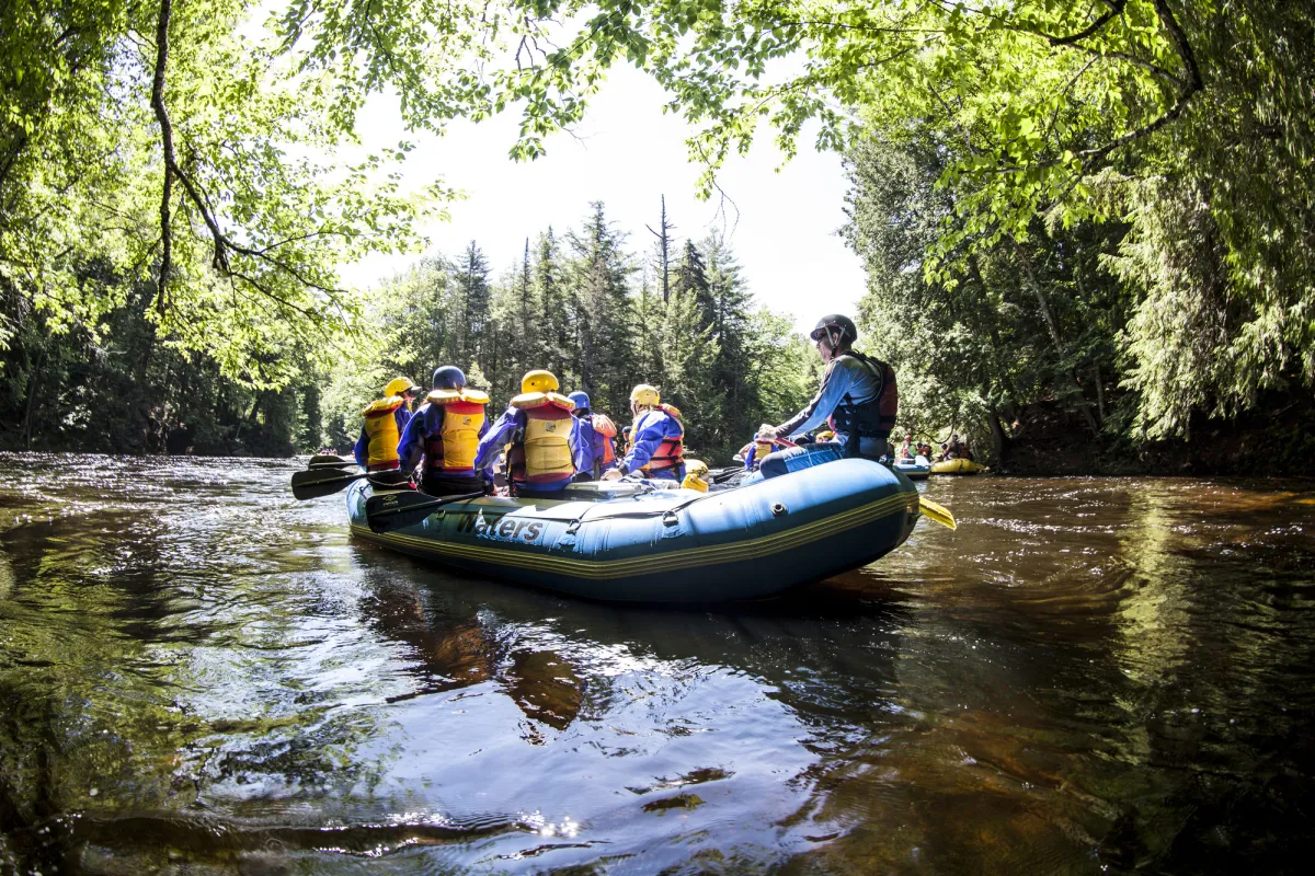 Whitewater rafters begin their journey on flatwater.