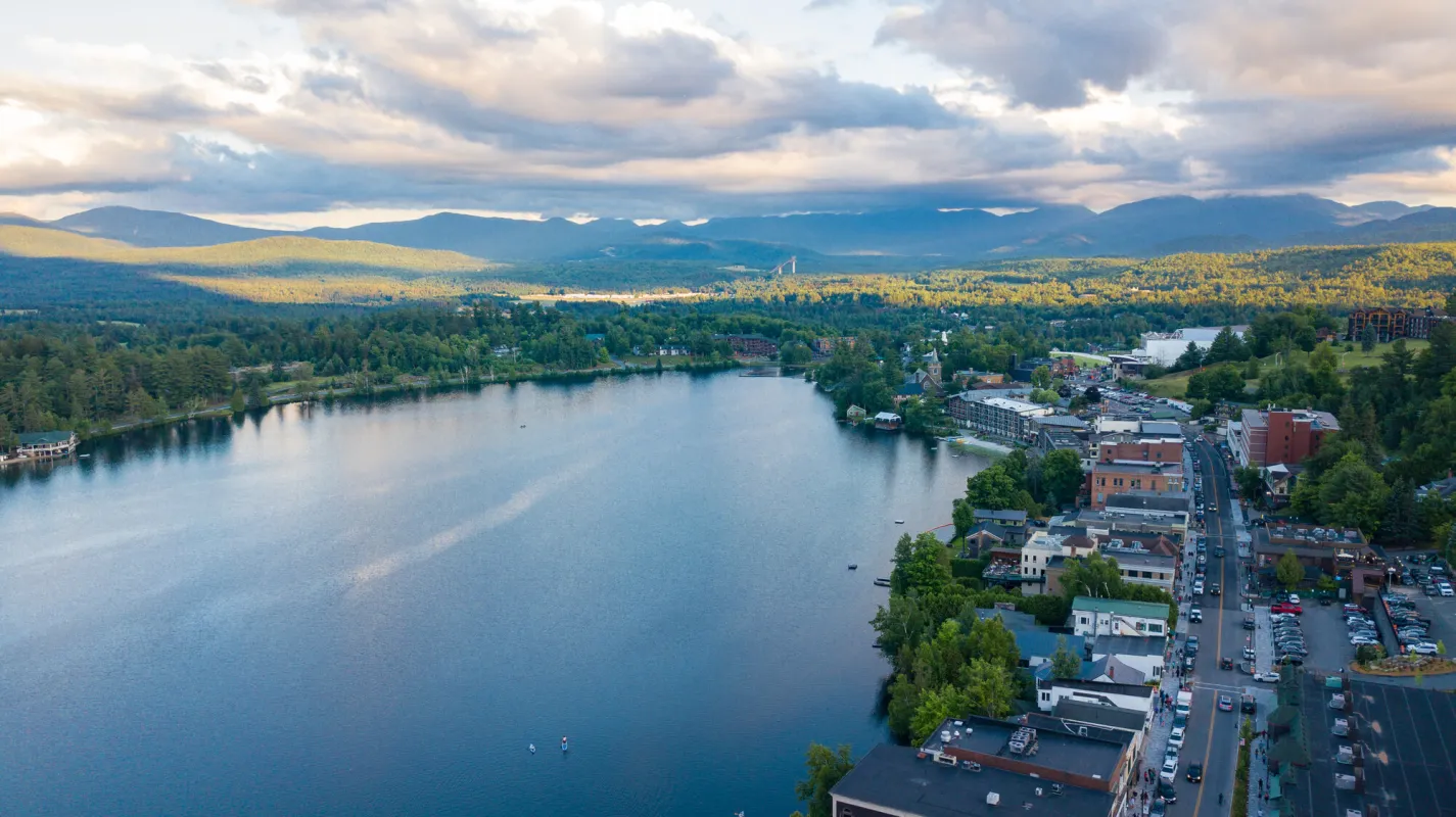 An aerial view of Lake Placid's Main street with views of Mirror Lake.