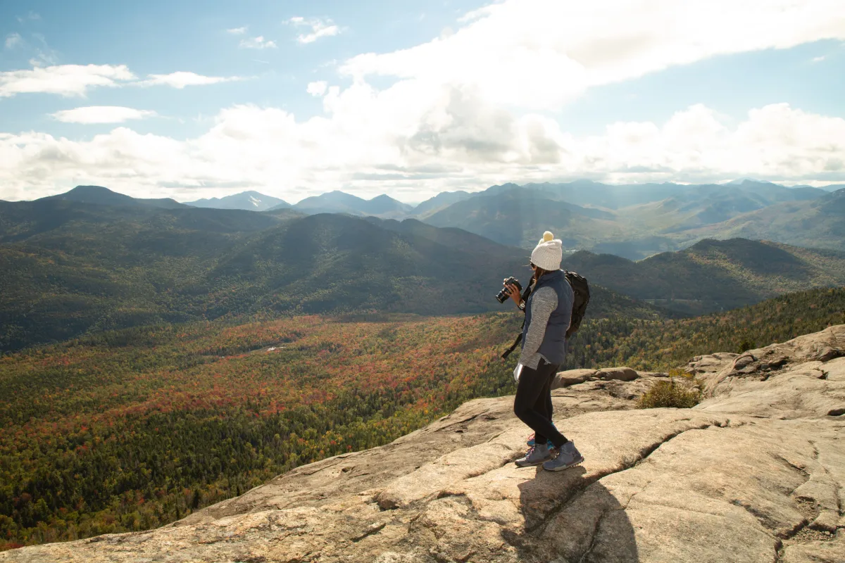 A hiker on a bald summit in the fall