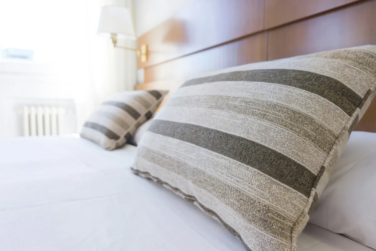 Striped pillows on a bed. 