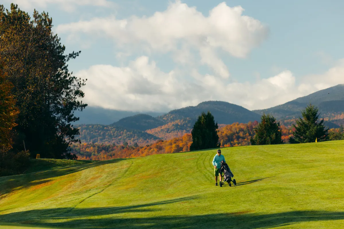 A golfer making his way to the next hole