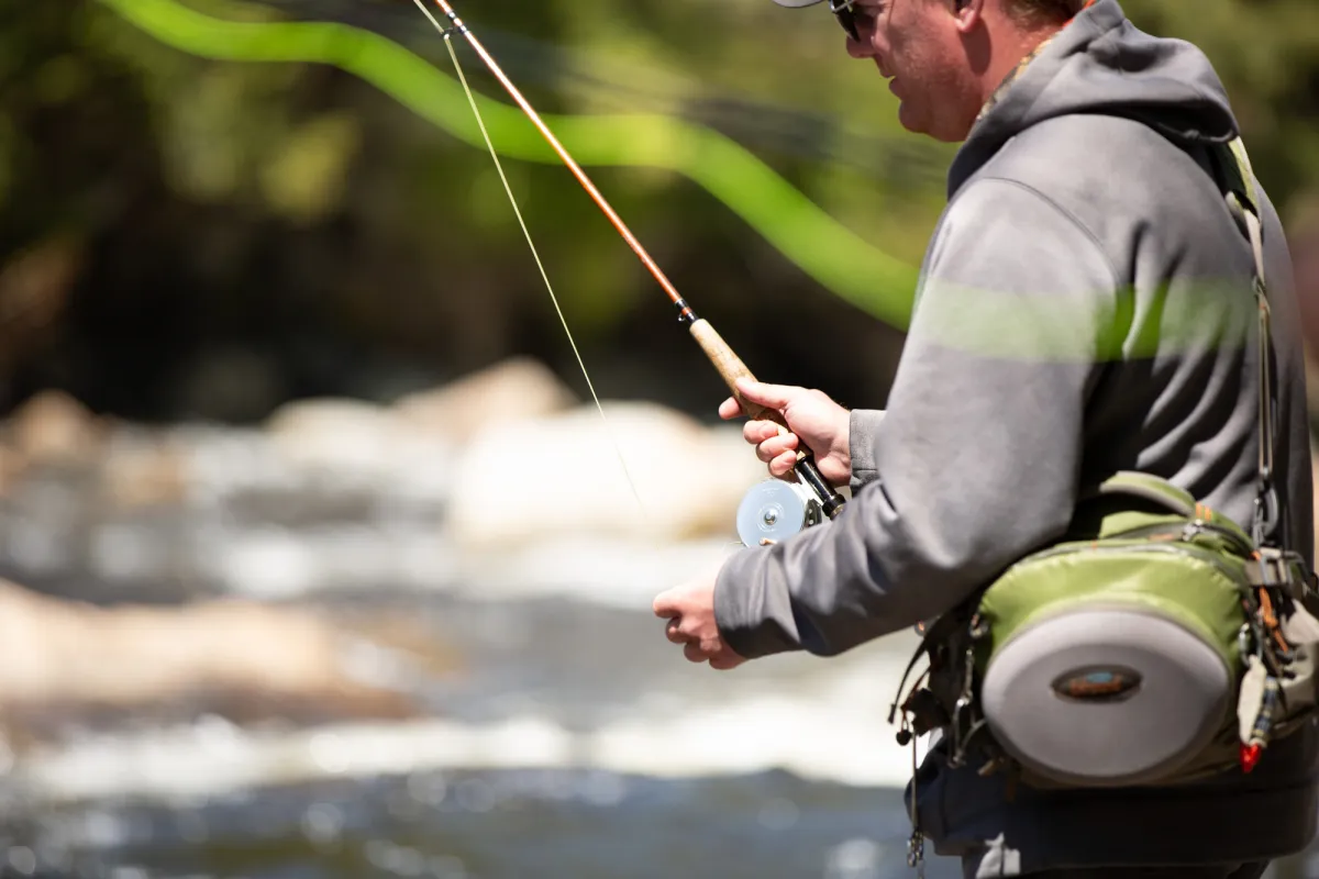 A fly fisher in the water
